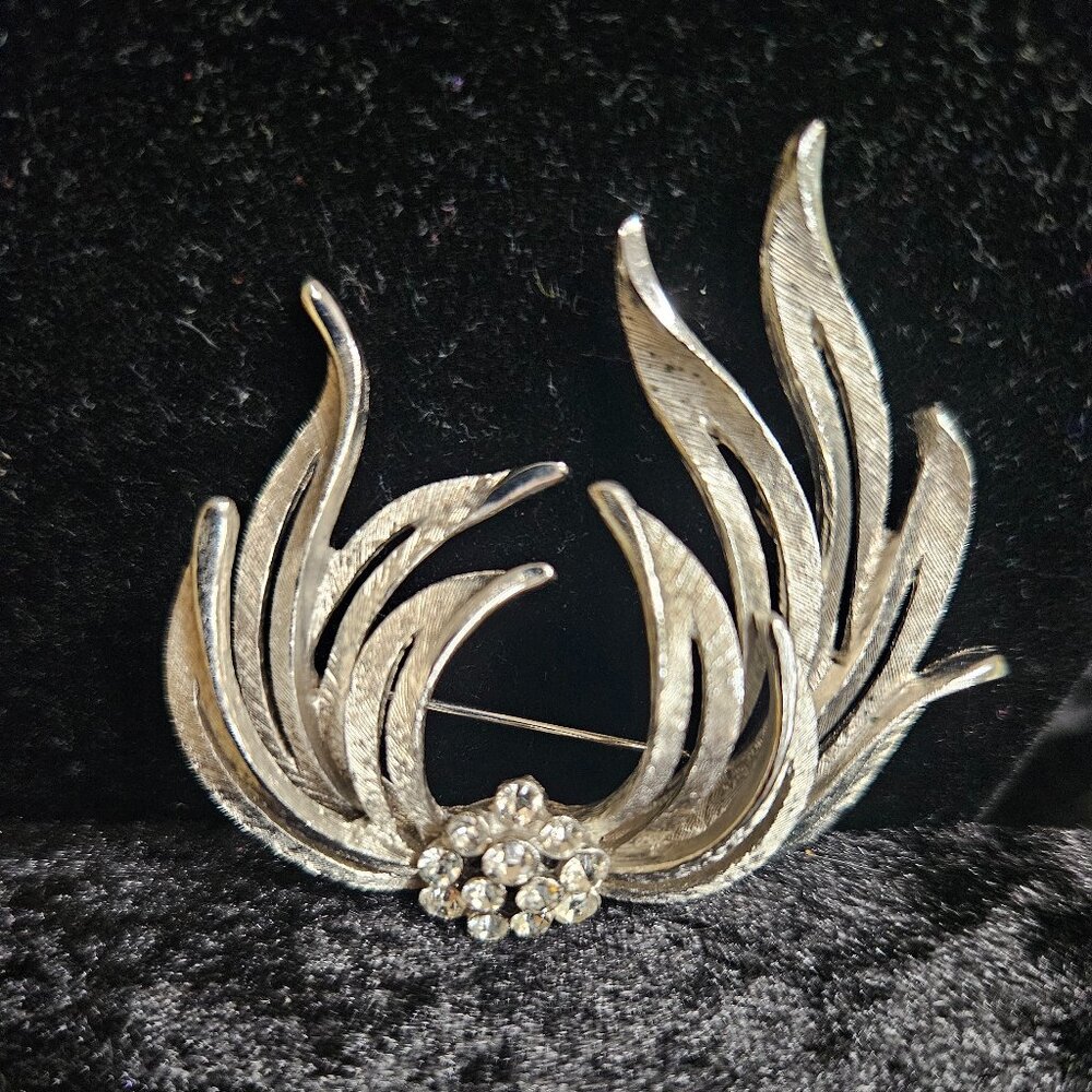 Vintage Silver toned signed JP Brooch with Rhinestone clustered center